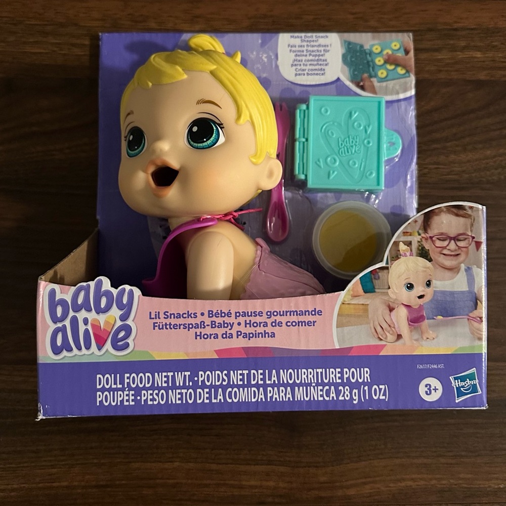Baby Alive Lil Snacks Doll with Blonde Hair and Purple Outfit